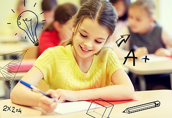 Image showing group of school kids writing test in classroom