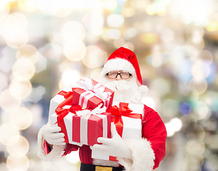 Image showing man in costume of santa claus with gift boxes