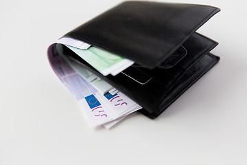 Image showing close up of euro paper money in wallet on table