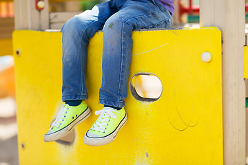 Image showing close up of boy legs on children playground