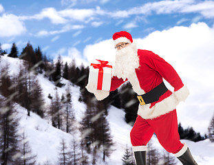 Image showing man in costume of santa claus with gift box