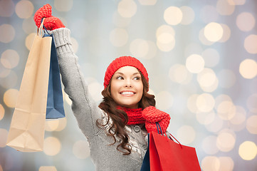 Image showing happy woman in winter clothes with shopping bags