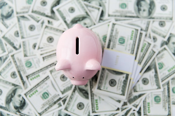 Image showing close up of dollar money and piggy bank from top