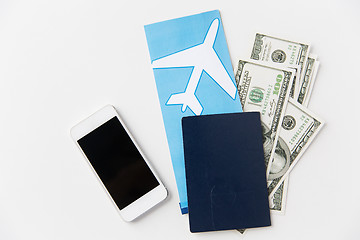 Image showing air ticket, money, smartphone and passport