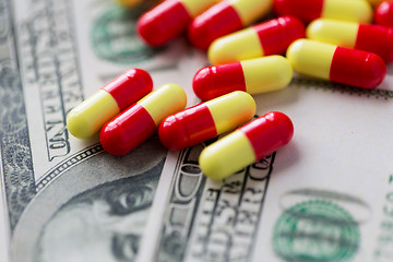 Image showing medical pills or drugs and dollar cash money