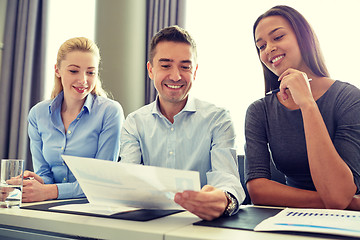 Image showing group of smiling businesspeople meeting in office