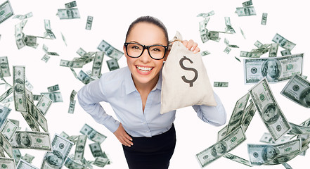 Image showing smiling businesswoman with dollar cash money