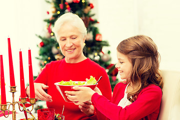 Image showing smiling family having holiday dinner at home