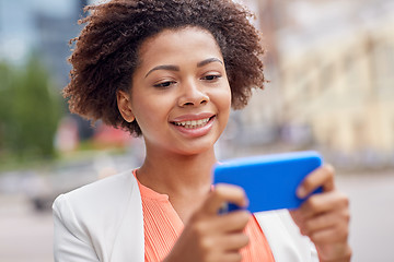 Image showing happy african businesswoman with smartphone