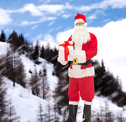 Image showing man in costume of santa claus with gift box