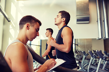 Image showing men exercising on treadmill in gym