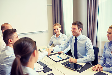 Image showing group of smiling business people meeting in office