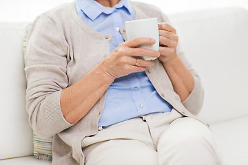 Image showing close up of senior woman with tea  cup at home