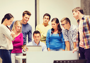 Image showing group of students and teacher with laptop