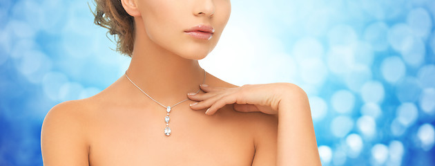 Image showing close up of woman wearing shiny diamond pendant