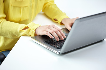 Image showing close up of woman with laptop computer in office