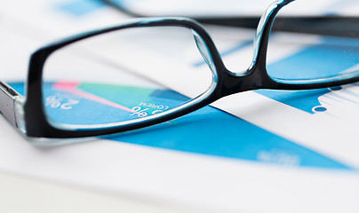 Image showing close up of eyeglasses and files on office table