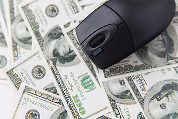 Image showing close up of computer mouse and usa dollar money