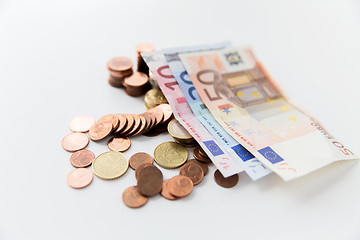 Image showing close up of euro paper money and coins on table