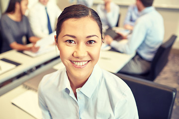 Image showing group of smiling businesspeople meeting in office