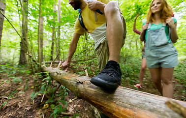 Image showing close up of friends with backpacks hiking