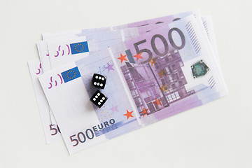 Image showing close up of black dice and euro cash money