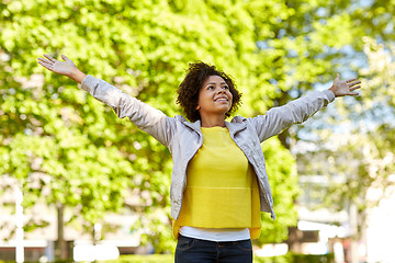 Image showing happy african american young woman in summer park