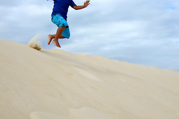 Image showing Child playing in the sand dune in South of Brazil