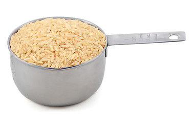 Image showing Long grain brown rice in a measuring cup