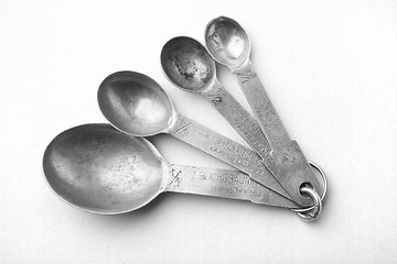 Image showing old silver different spoons isolated\r\n