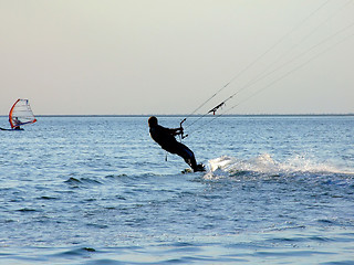 Image showing Silhouette of a kite-surf on waves of a gulf 1