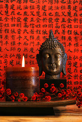 Image showing Asian candle with red orential background