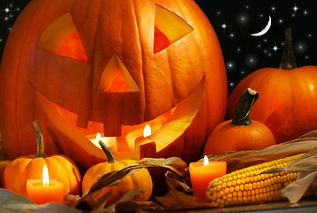 Image showing Carved pumpkin with candles