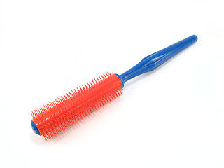 Image showing red and blue hairbrush
