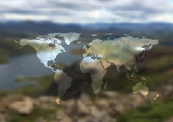 Image showing Polygonal world map on blurred landscape background