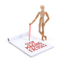 Image showing Wooden mannequin writing - Stop making excuses