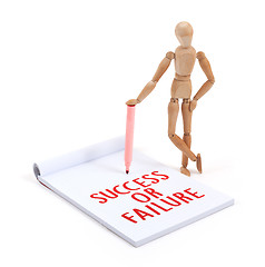 Image showing Wooden mannequin writing - Success or failure