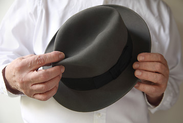 Image showing businessman with an old felt hat	