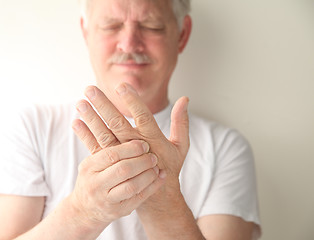 Image showing senior with numb hand  