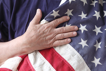 Image showing USA flag held by a veteran