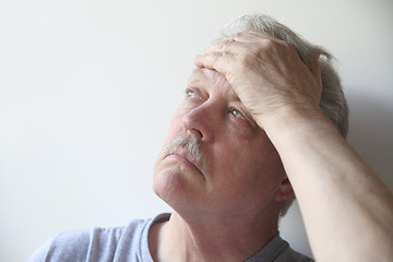 Image showing senior with head pain
