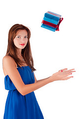 Image showing Young pretty woman catches gift box