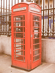 Image showing Retro looking Red phone box in London