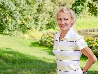 Image showing Portrait of a middle-aged woman in a park on a sunny day
