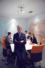 Image showing senior business man with his team at office