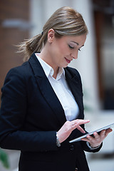 Image showing business woman working on tablet