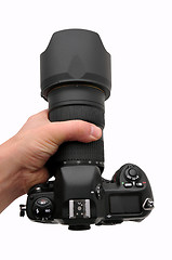 Image showing Camera SLR professional in hand isolated