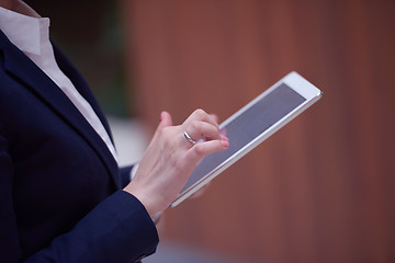 Image showing business woman working on tablet