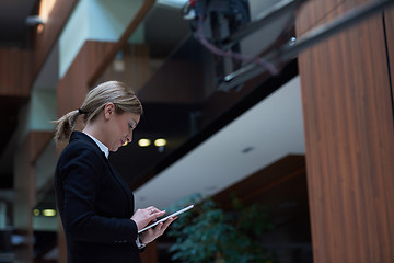 Image showing business woman working on tablet