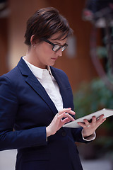 Image showing business woman working on tablet